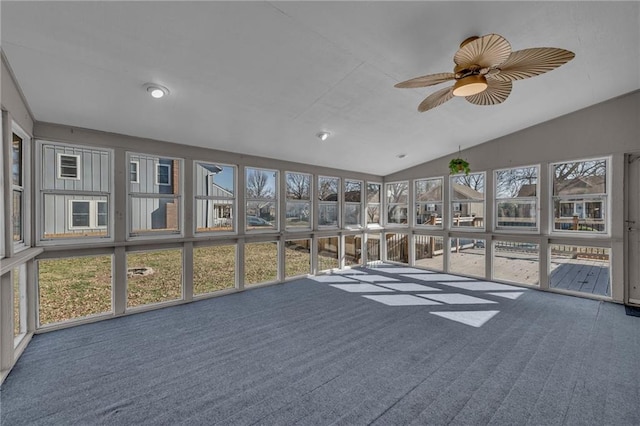 unfurnished sunroom with ceiling fan and lofted ceiling