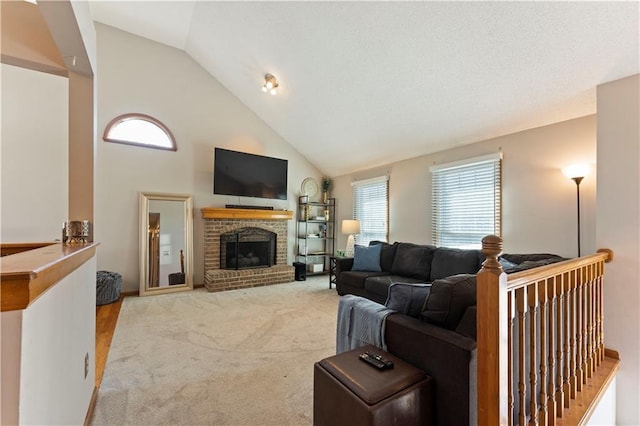 living room featuring a brick fireplace, carpet, and high vaulted ceiling