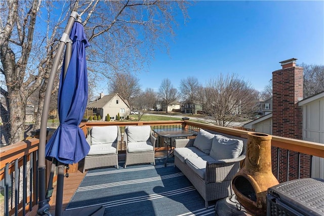 wooden terrace with outdoor lounge area