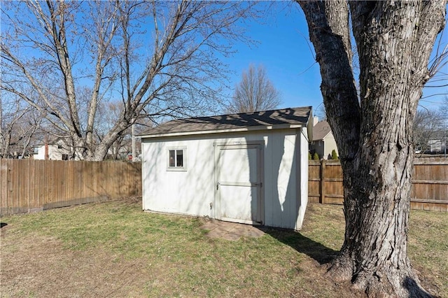 view of shed featuring a fenced backyard