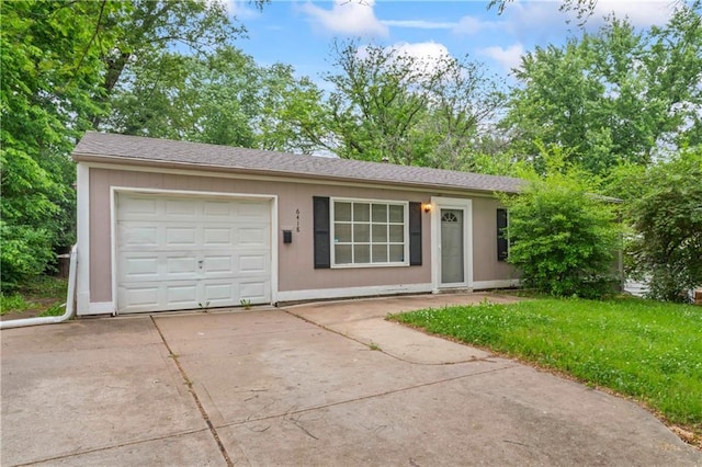 6418 E 150th St, Grandview, MO 64030 - ranch-style house featuring driveway, an attached garage, and a front lawn