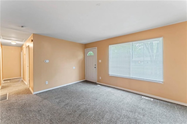 6418 E 150th St, Grandview, MO 64030 - carpeted spare room featuring baseboards