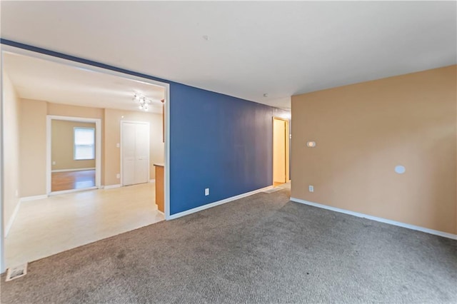 6418 E 150th St, Grandview, MO 64030 - unfurnished room featuring carpet flooring and baseboards