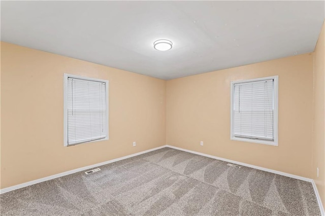 6418 E 150th St, Grandview, MO 64030 - carpeted empty room featuring baseboards
