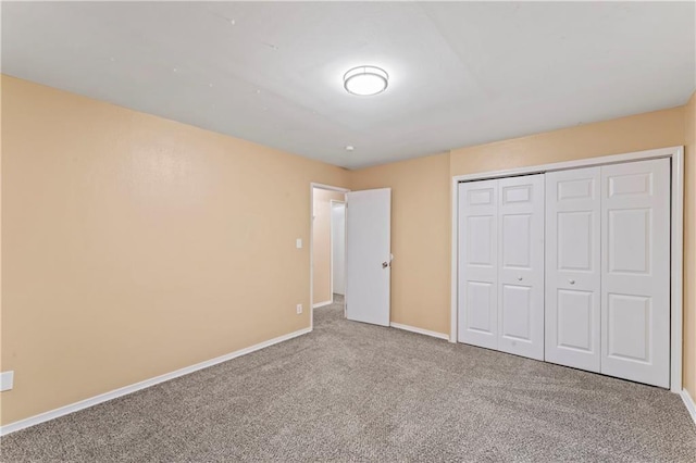 6418 E 150th St, Grandview, MO 64030 - unfurnished bedroom with carpet floors, baseboards, and a closet