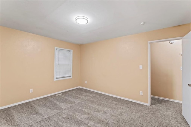 6418 E 150th St, Grandview, MO 64030 - empty room with carpet and baseboards