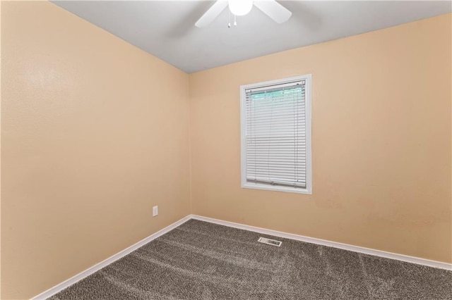 6418 E 150th St, Grandview, MO 64030 - unfurnished room featuring dark carpet, baseboards, and ceiling fan