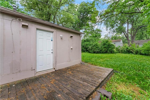 6418 E 150th St, Grandview, MO 64030 - wooden deck featuring a lawn and an outdoor structure