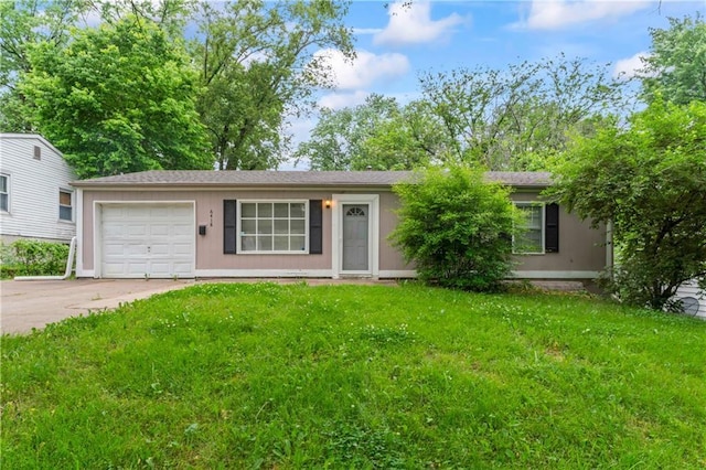 6418 E 150th St, Grandview, MO 64030 - view of front of house with an attached garage, driveway, and a front lawn