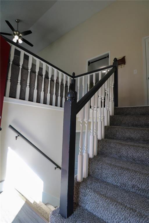 stairway with ceiling fan