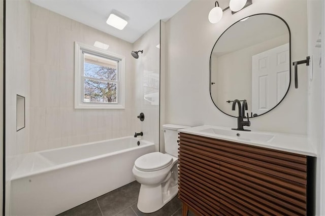 full bath featuring tile patterned floors, toilet, vanity, and bathtub / shower combination