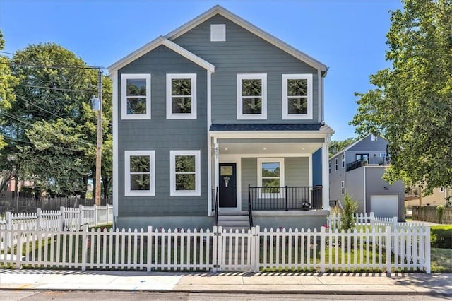 view of front of house featuring a fenced front yard and a porch