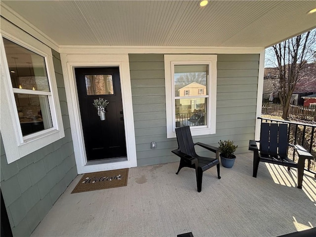 property entrance with covered porch