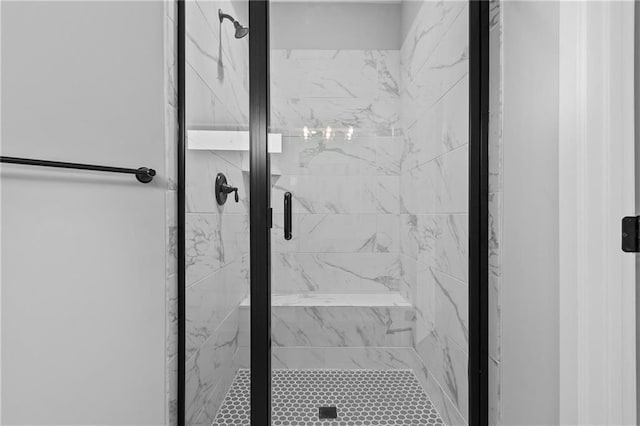 bathroom with a shower stall