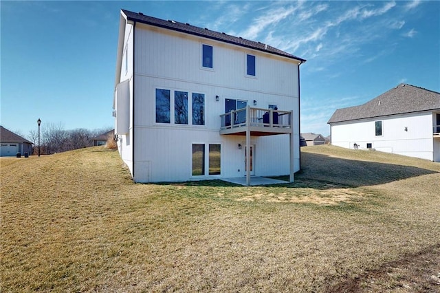 rear view of house featuring a yard