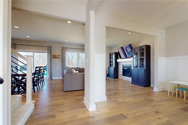 interior space featuring recessed lighting, light wood-type flooring, and visible vents