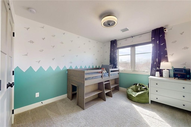 bedroom with visible vents, wallpapered walls, baseboards, and carpet floors