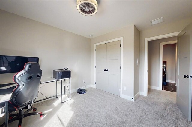 office area featuring visible vents, baseboards, and carpet floors