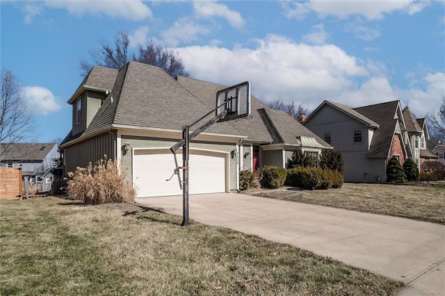 view of front facade with a garage, a front yard, roof with shingles, and driveway