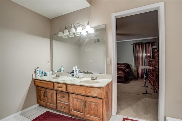 bathroom featuring a sink, visible vents, double vanity, and tile patterned flooring