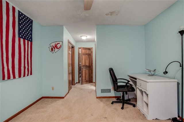 office with light colored carpet, baseboards, and visible vents