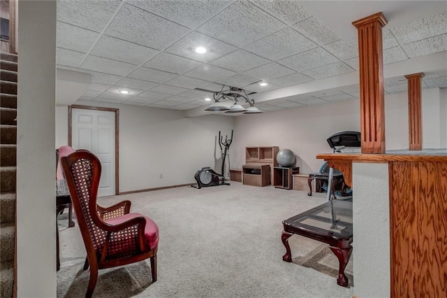 exercise area with baseboards, a drop ceiling, decorative columns, carpet floors, and recessed lighting