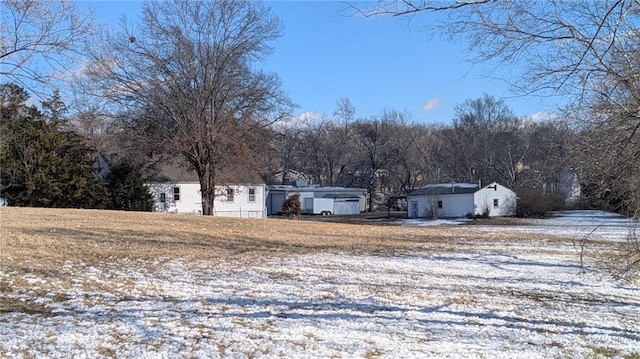 view of yard covered in snow