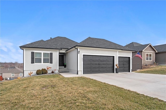 ranch-style house featuring a front yard, concrete driveway, roof with shingles, and an attached garage