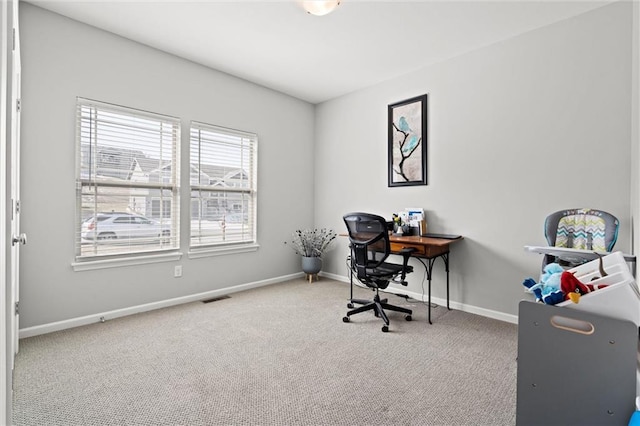 office area featuring carpet, visible vents, and baseboards