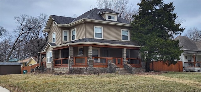 view of front facade featuring covered porch and a front yard