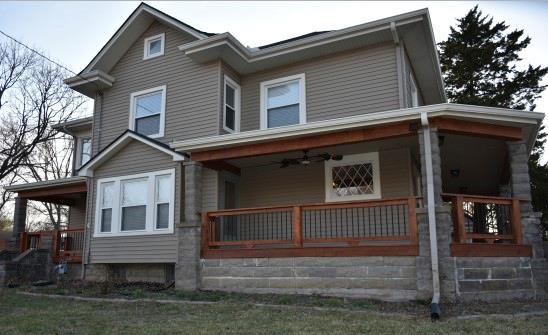 view of front facade with a porch and a ceiling fan