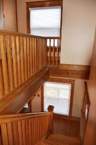 stairway with wood finished floors