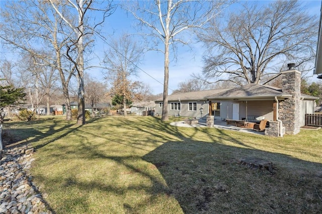 view of yard with fence and a patio area