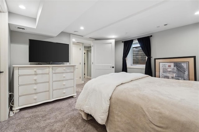 carpeted bedroom with recessed lighting and visible vents