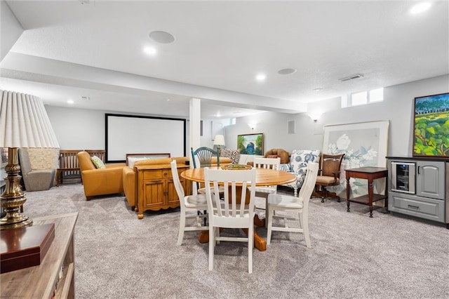 dining space featuring recessed lighting, visible vents, and light colored carpet