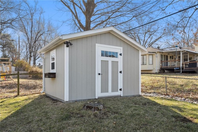 view of shed featuring fence