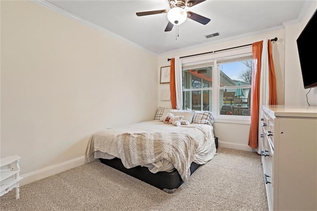 bedroom featuring light carpet, visible vents, baseboards, and ornamental molding