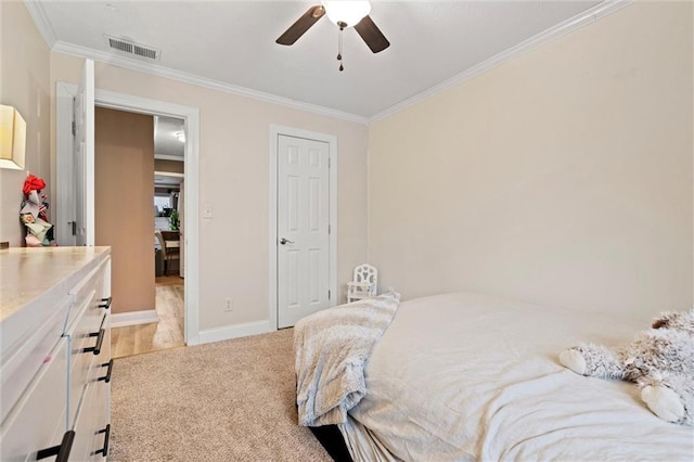 bedroom with a ceiling fan, baseboards, visible vents, light carpet, and crown molding