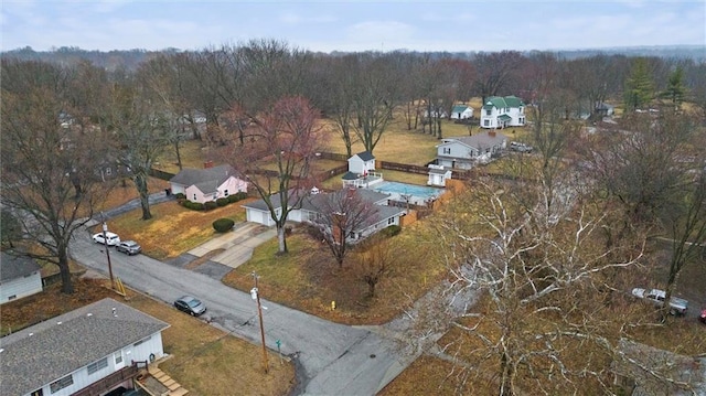 birds eye view of property featuring a forest view