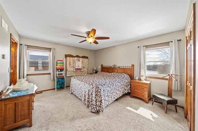 bedroom featuring carpet flooring, baseboards, and ceiling fan