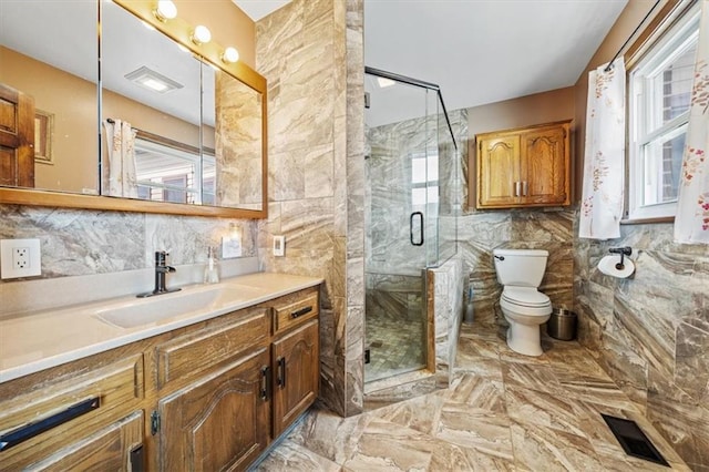 bathroom featuring visible vents, toilet, tile walls, and a stall shower