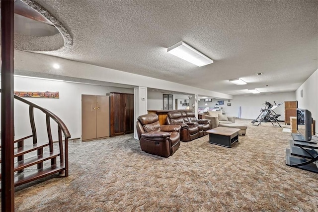 carpeted living area featuring a textured ceiling