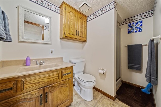 full bathroom featuring an enclosed shower, toilet, a textured ceiling, baseboards, and vanity