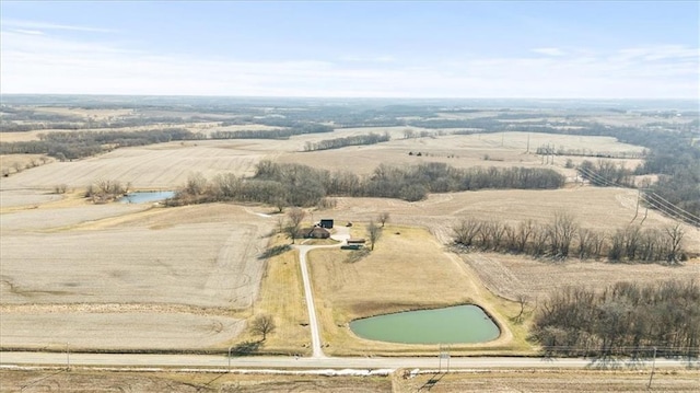 aerial view with a rural view and a water view