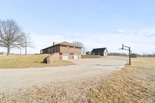 exterior space with a garage and driveway