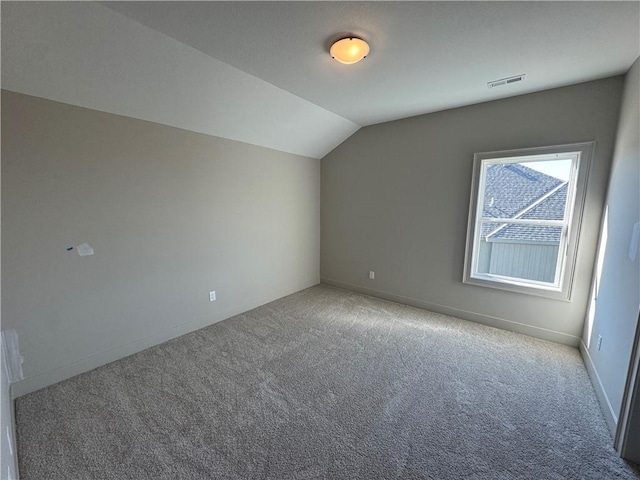 bonus room with visible vents, baseboards, carpet, and lofted ceiling