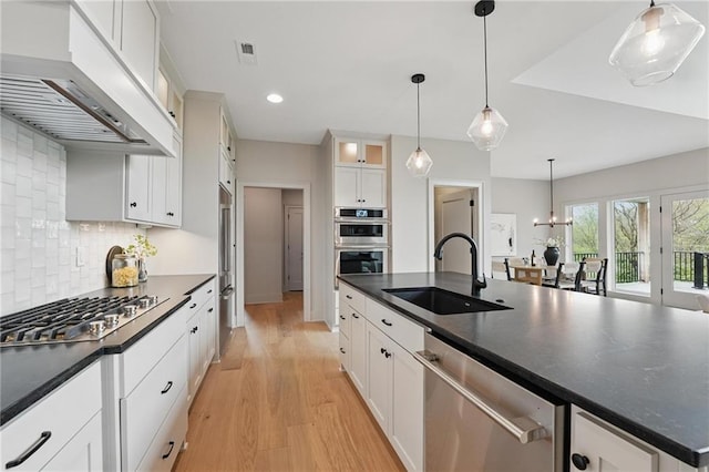 1506 NW 106th Ter, Kansas City, MO 64155 - kitchen featuring stainless steel appliances, dark countertops, custom exhaust hood, and a sink