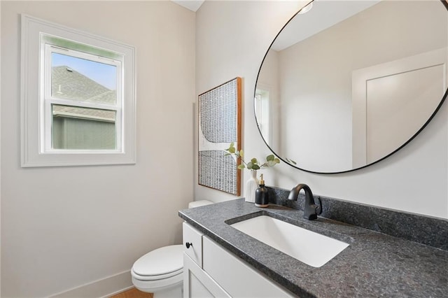 1506 NW 106th Ter, Kansas City, MO 64155 - bathroom with toilet, baseboards, and vanity