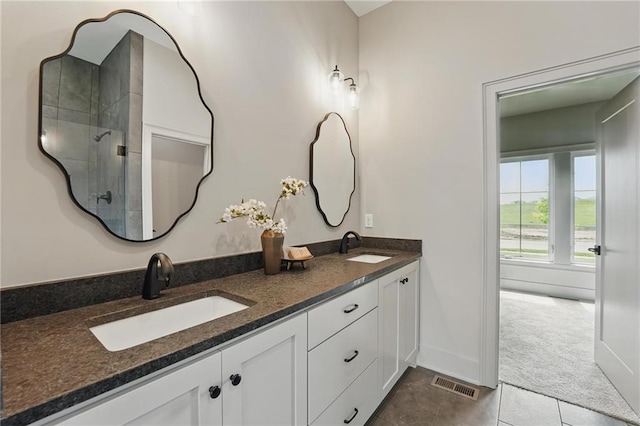 1506 NW 106th Ter, Kansas City, MO 64155 - full bathroom featuring visible vents, a sink, tile patterned floors, and tiled shower
