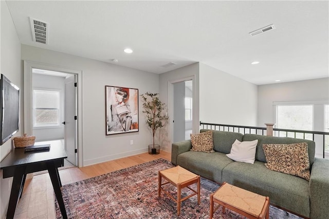 1506 NW 106th Ter, Kansas City, MO 64155 - living room featuring recessed lighting, baseboards, visible vents, and light wood-style floors